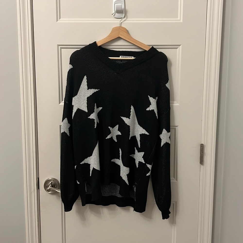 Super cute star sweater! Not too heavy and gently worn.